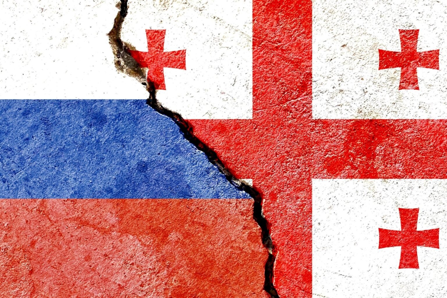 Флаги России и Грузии с трещиной между ними