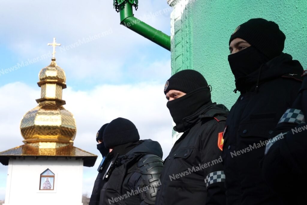 Masked police officers with golden church dome in background