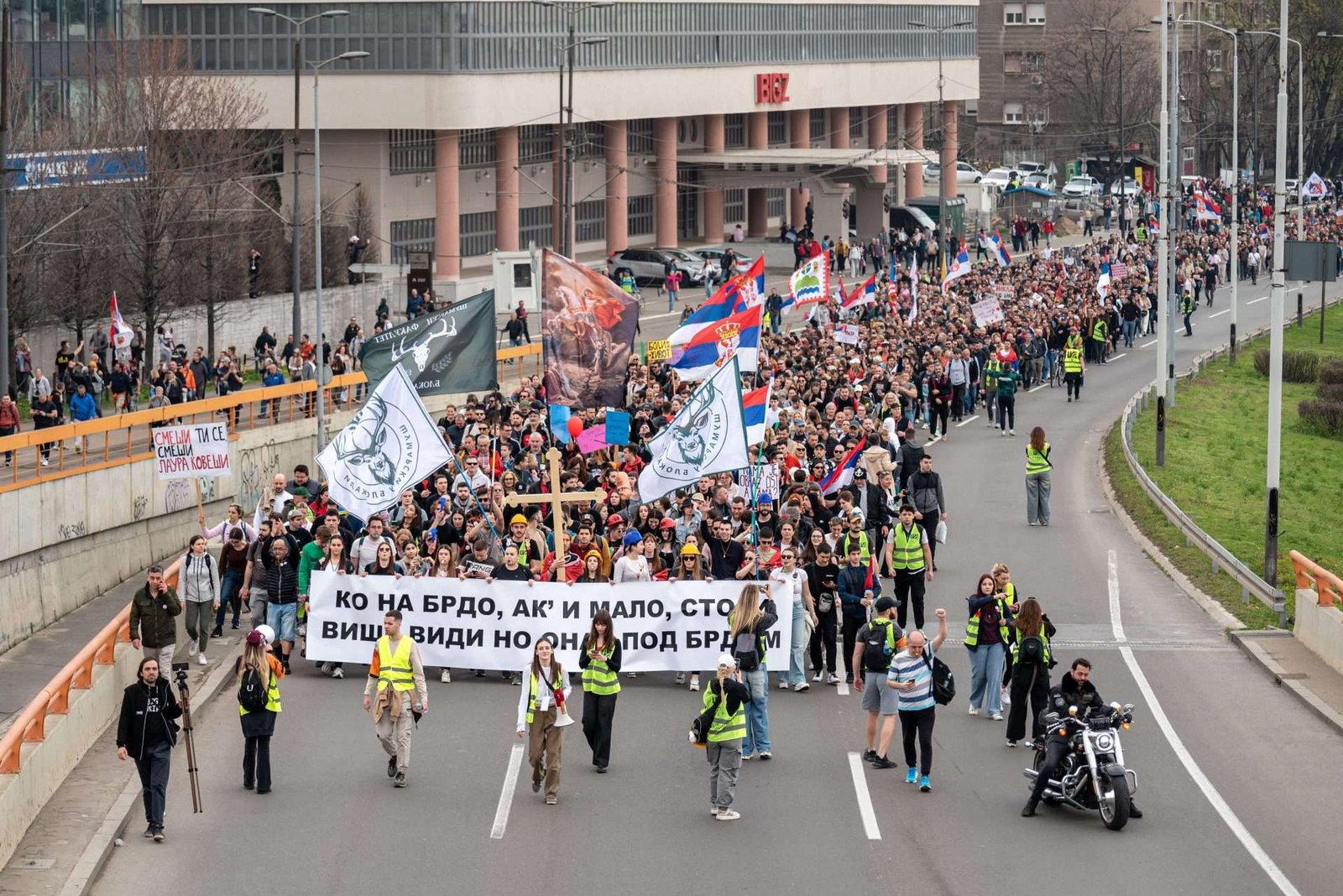 Mass protest march in Serbia with religious icons and Serbian flags