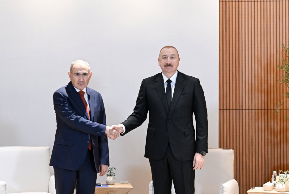 Pashinyan and Aliyev shaking hands at diplomatic meeting