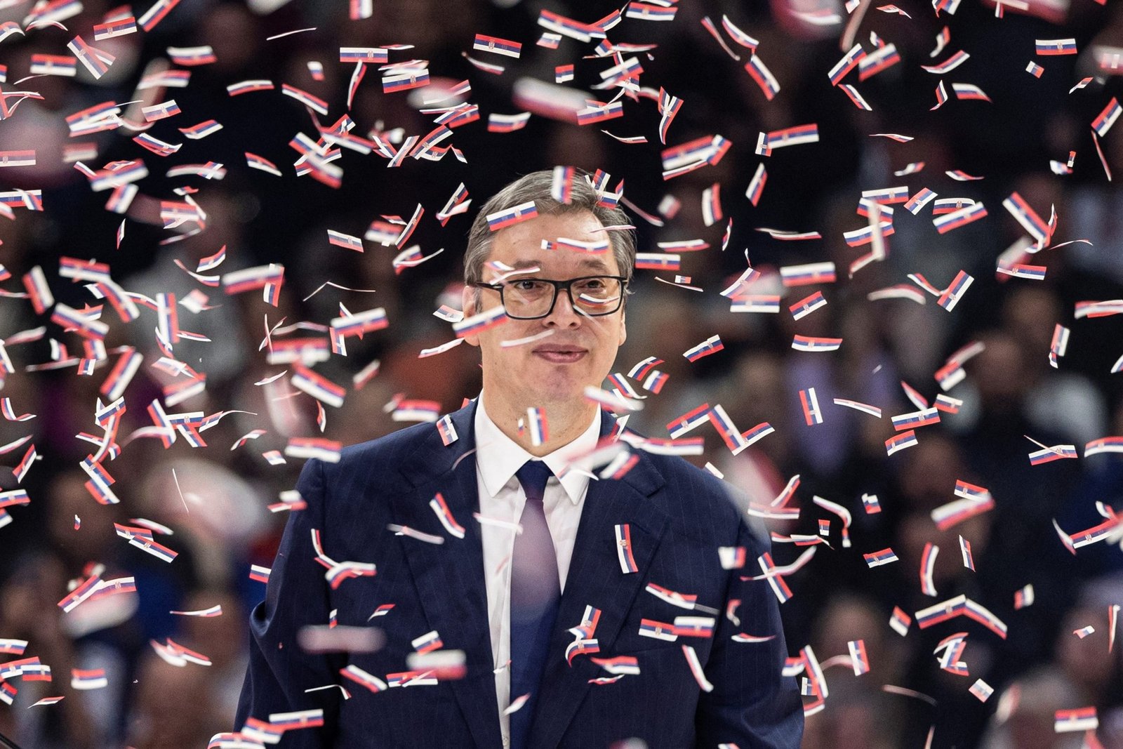 Vučić at political rally with Serbian flag confetti