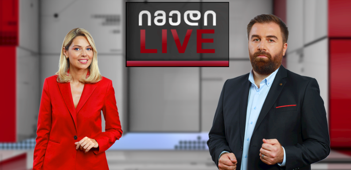 Студия Imedi TV с двумя ведущими и вывеской Imedi LIVE