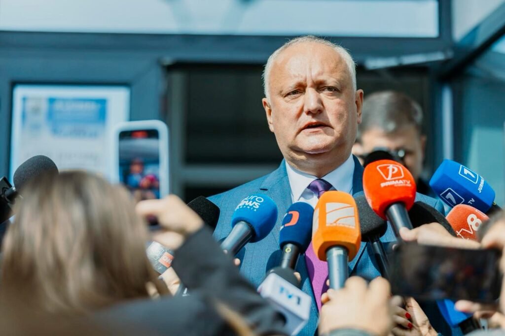 Igor Dodon speaking to journalists with microphones