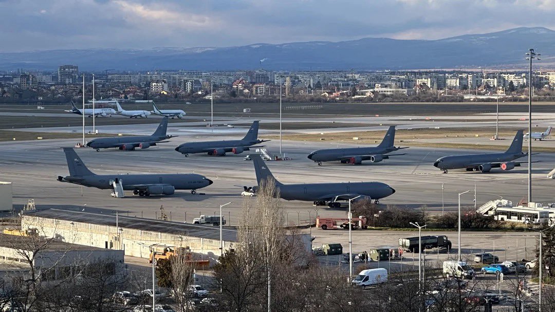 US military KC-135 Stratotanker aircraft lined up at Sofia Airport with mountains and city visible