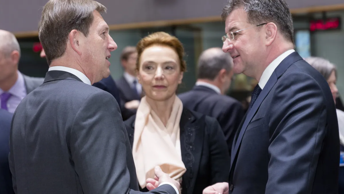 Diplomatic meeting scene with officials