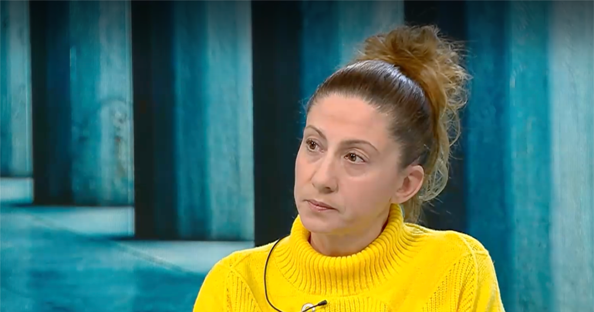 Woman in yellow sweater during interview - likely witness or family member