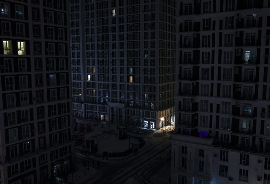 Dark apartment buildings in Kyiv with almost no lights during power outage after attacks