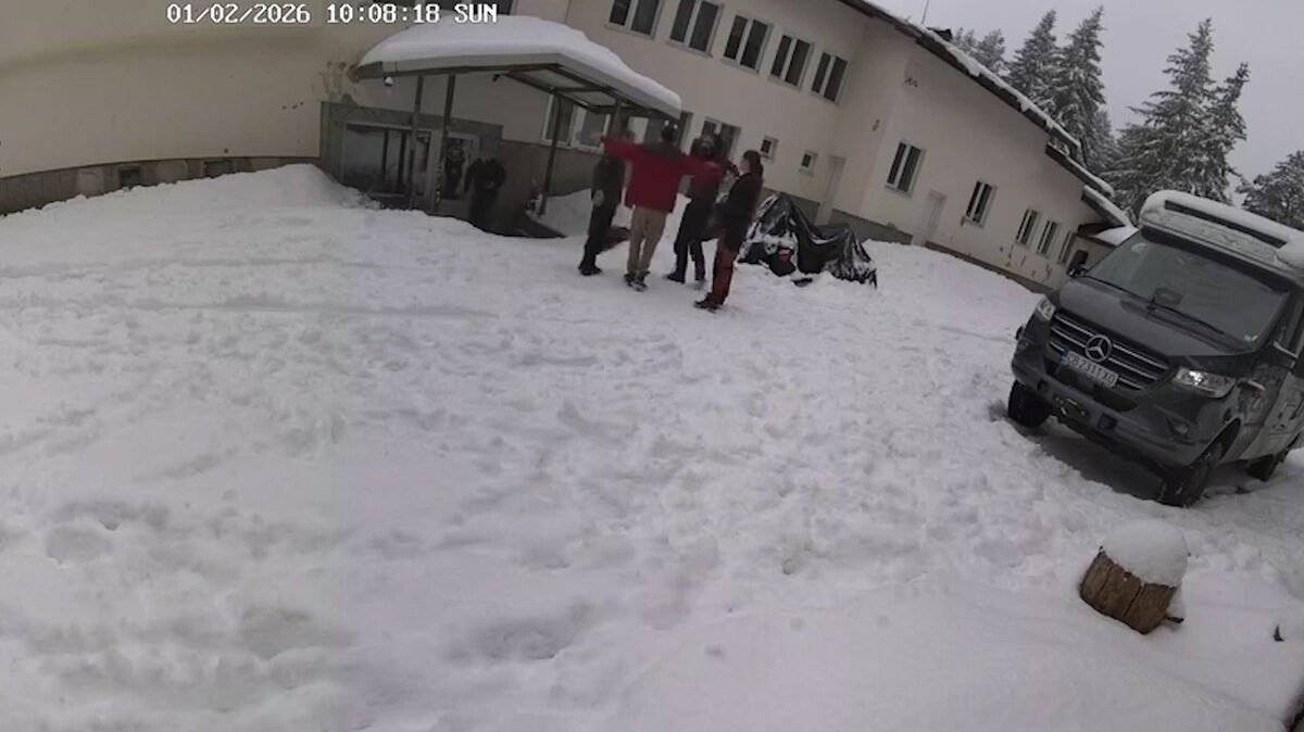 CCTV footage showing people at building, timestamped 01/02/2026