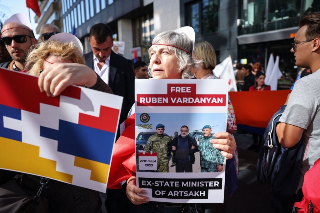 Protesters with Free Ruben Vardanyan sign and Artsakh flag