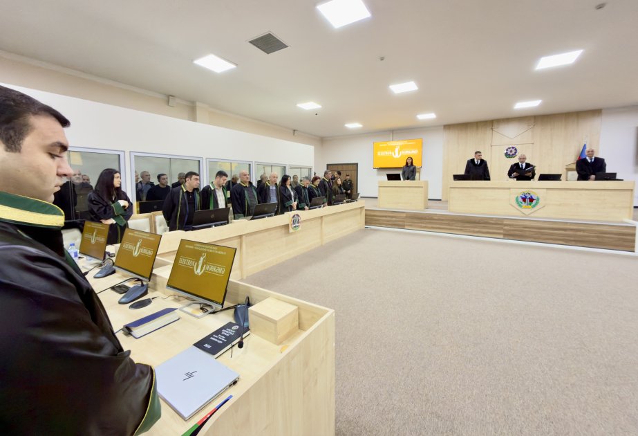 Wide shot of courtroom with lawyers and judges