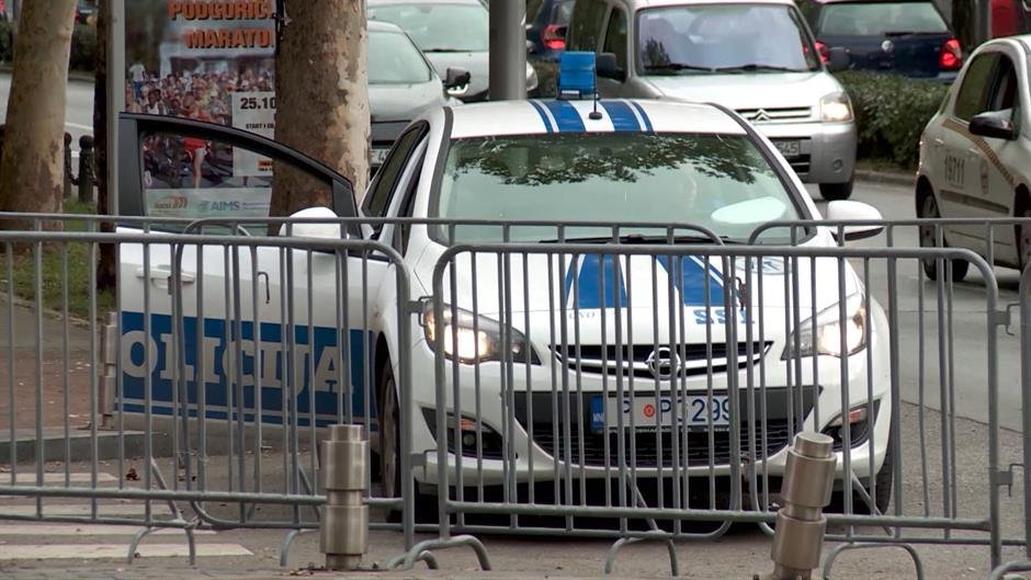 Montenegrin police car behind metal barriers