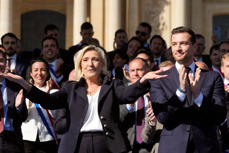 Marine Le Pen and Jordan Bardella of French National Rally party - representing European far-right discussed in article