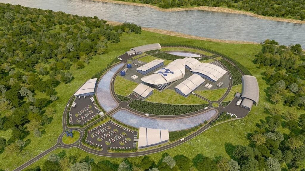 Дойчешть: ЕС открыл путь к первому модульному реактору Европы 3D-визуализация площадки малого модульного реактора (SMR) в Дойчешть, Румыния — вид сверху на комплекс, окружённый зелёными насаждениями на берегу реки