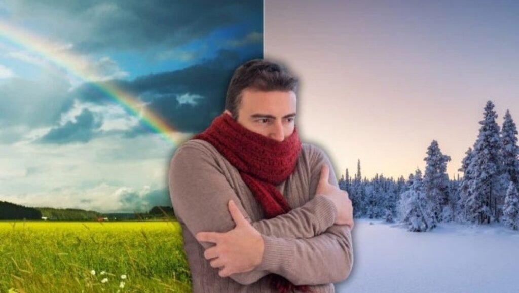 Мужчина в тёплом шарфе на фоне контраста весеннего пейзажа и заснеженного зимнего леса